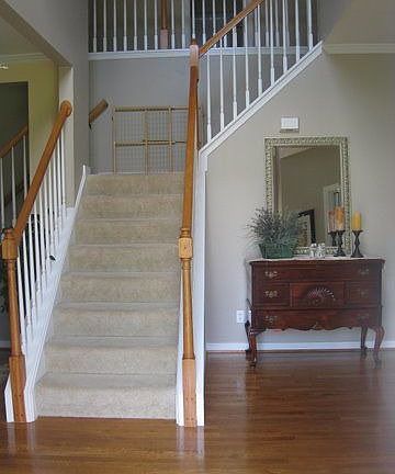2 sty foyer with double staircase