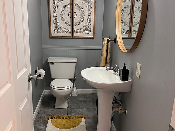 Downstairs powder room between living room and Kitchen/powder room