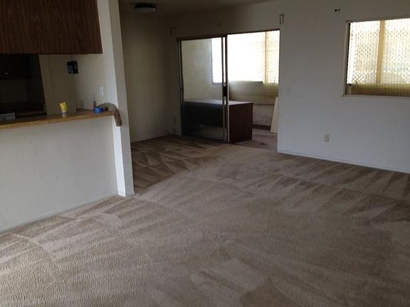 Living Room looking into Dining Room, Deck, and kitchen coun