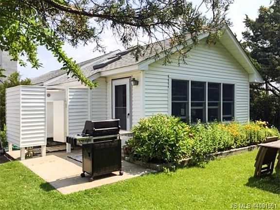BACK OF THE HOUSE AND OUTSIDE SHOWER