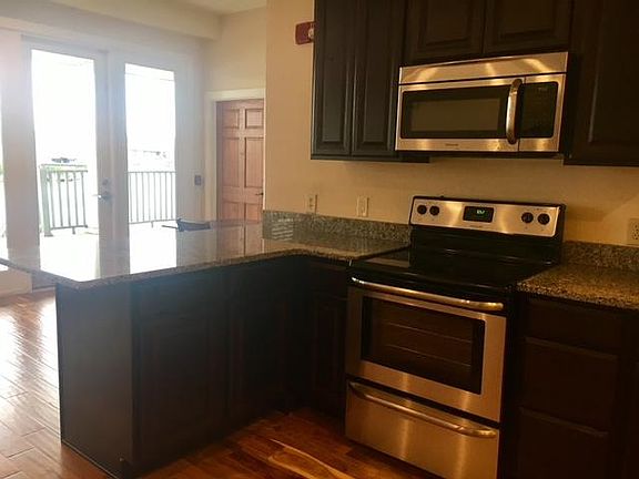 Granite countertops, and bar with room for barstools- B2
