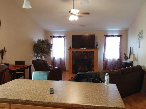 Living room with vaulted ceiling and gas fireplace