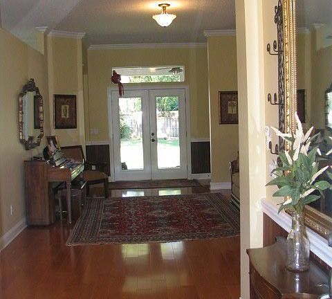 Bright inviting view from the entry foyer to the rear patio