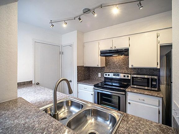 Microwave included along with stainless-steel appliances.