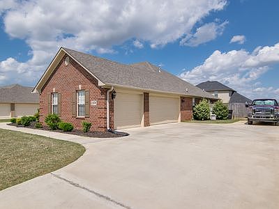 3 Car Garage & Parking Area
