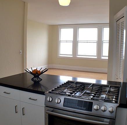 View from kitchen peninsula into dining/living area