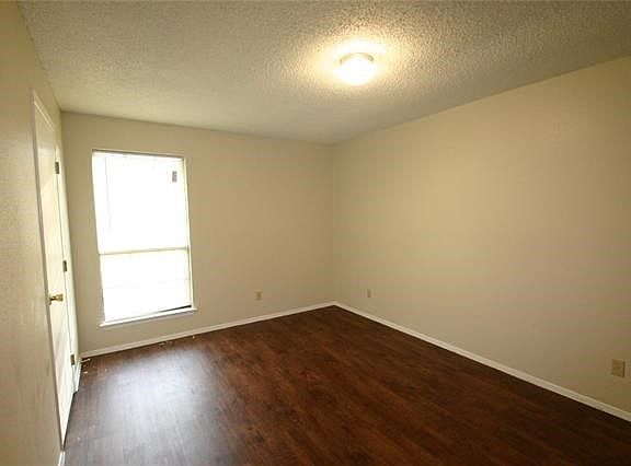 Bedrooms with new vinyl plank flooring, lighting and mini bl