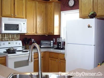 Kitchen
						:
						Convient work triangle, ceramic tile, pull out faucet, oak cabinets, pantry.