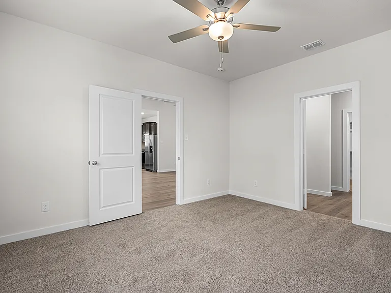 The master suite has a large bedroom, ensuite bathroom and a walk-in closet.