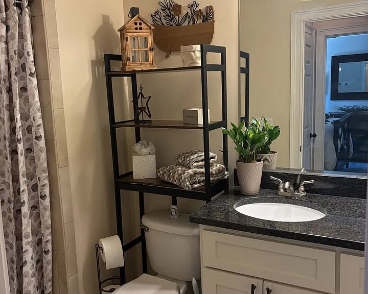 Beautiful full-size bathroom with deep walk-in shower. Plenty of hot water and central air/heat throughout apartment.