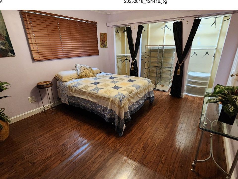 Larger bedroom with a huge closet, queen bed and space for your own desk and couch.