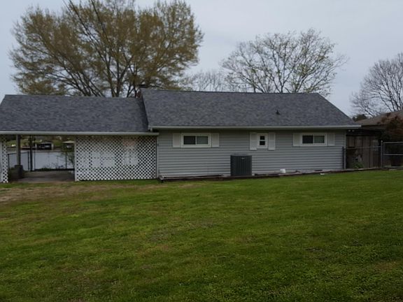 House facing street, fenced yard
