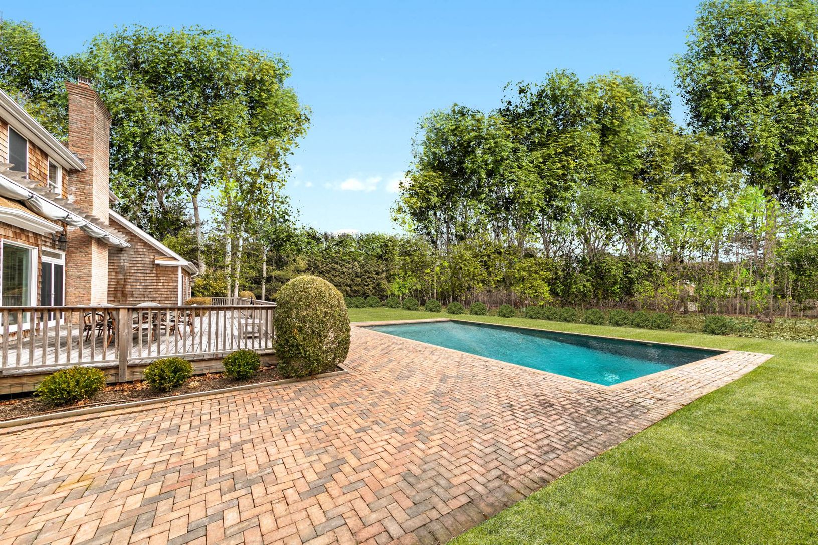  SIDE VIEW OF DECK AND HEATED VINYL SWIMMING POOL