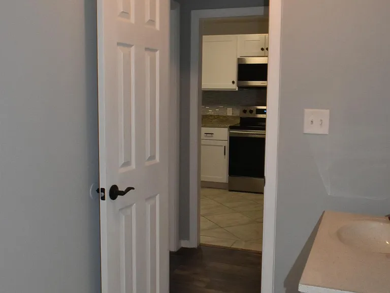 Bathroom to hallway and kitchen