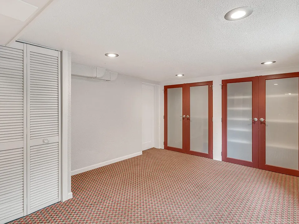 Living room, closets, door to bedroom