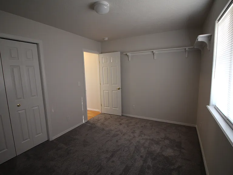 Rear bedroom with wrap around upper shelf