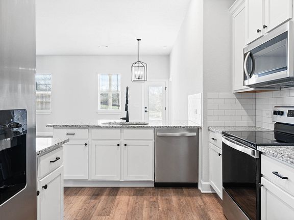 The kitchen has energy-efficient appliances.