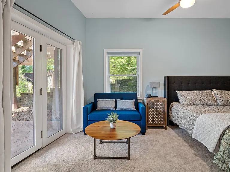 Third bedroom located in the lower level with king bed and twin pullout sofa with lake views.