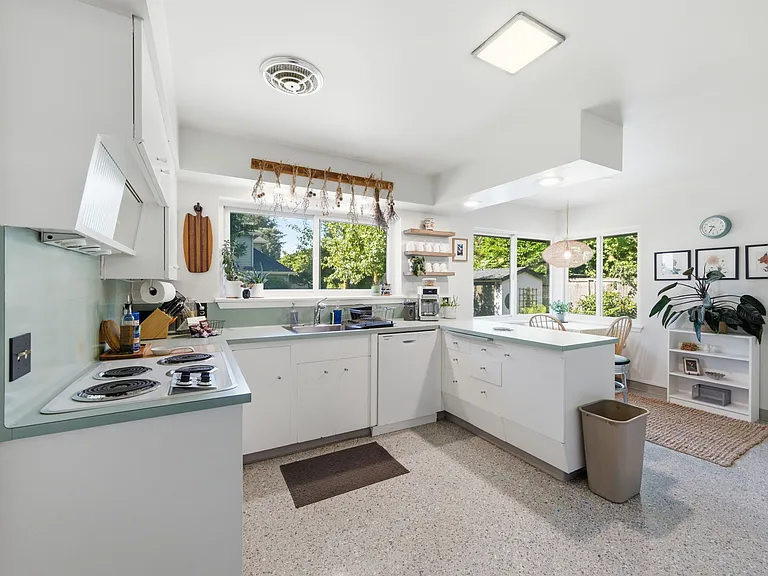 South-facing kitchen faces backyard and brand new dishwasher