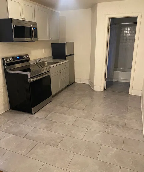 Kitchen and dining area. Window out of view allows for fresh air while cooking.