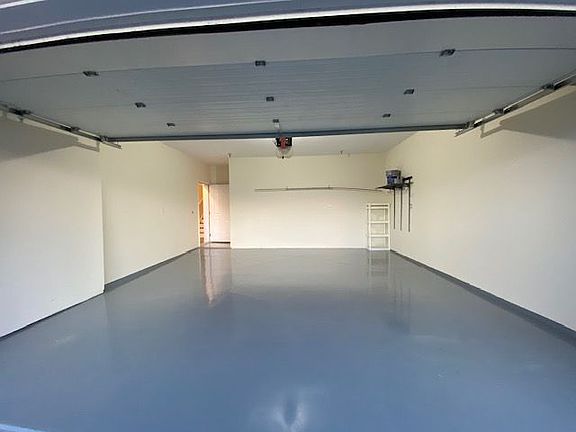 2-car attached garage with interior access and coded entry.