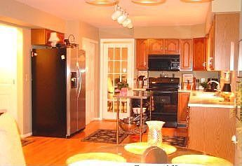 Kitchen w/hardwood floors.