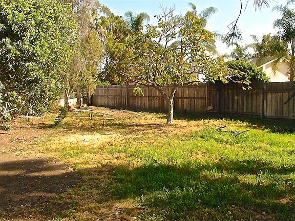 Large backyard is level & fenced