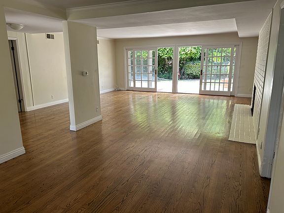 Living room opening to backyard patio
