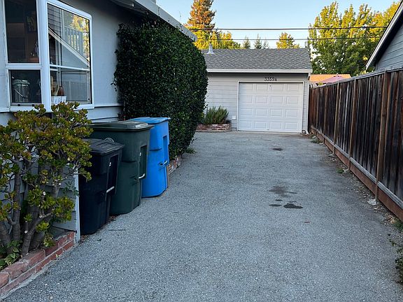 Long driveway. Shared Garbage, Recycling and Compost receptacles. Shared Laundry in Garage.