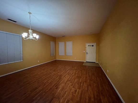 Living room pointing to Entrance Door