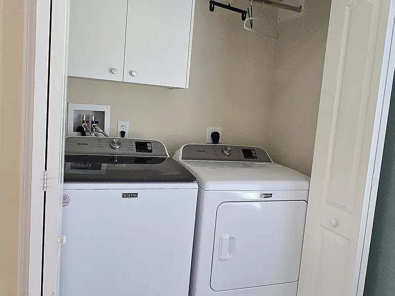 Laundry area conveniently located in a corner area of the kitchen