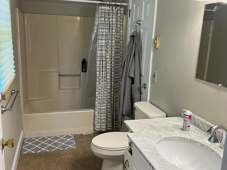 Main bathroom from master bedroom tiled floor new vanities