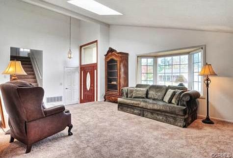 ...and a pretty bay window looking out to the front. New carpeti