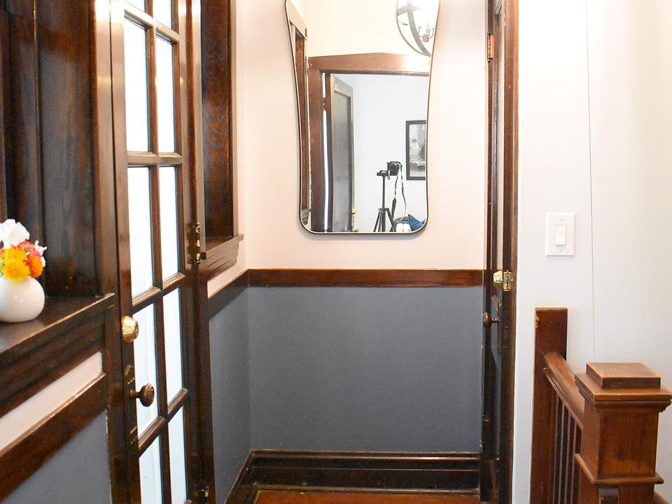 Foyer w/ coat closet (right door) and office (left door).