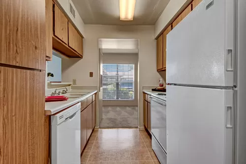 A kitchen with lots of cabinet space and easy access to the dining area - High Plains