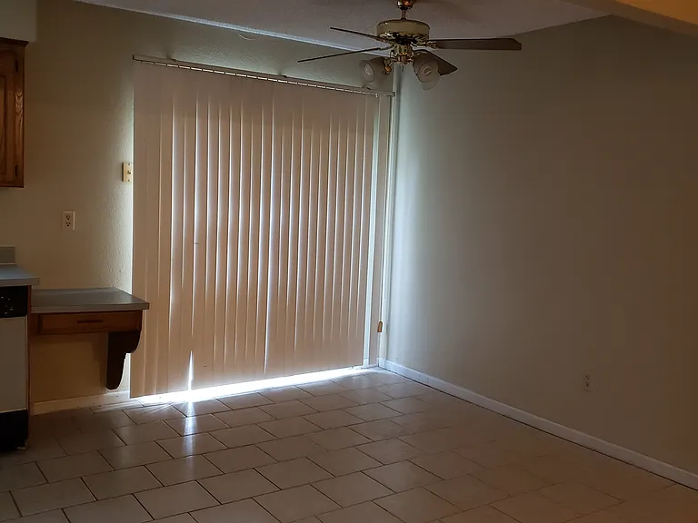 Eat in kitchen area showing sliding patio door.