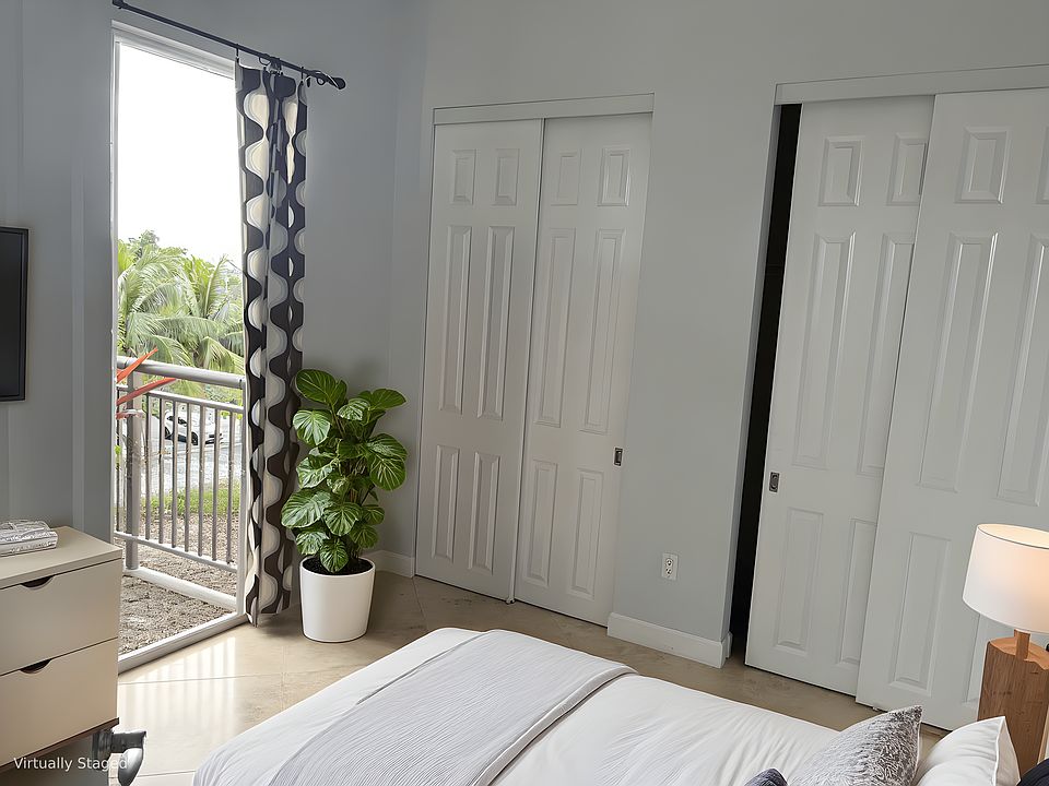 Virtually staged. Small bedroom with a large closet. I used it as an office as well.