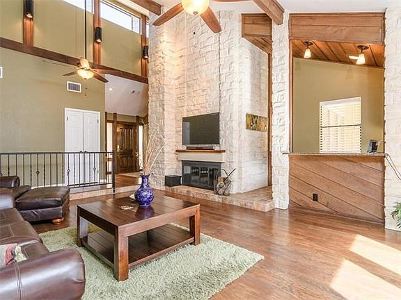 Vaulted ceiling and scraped hardwood floors make for a grand (yet cozy) living area with wet bar or entertaining!