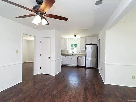 View from Dining to Kitchen. Bonus room with fireplace to the right of this pic