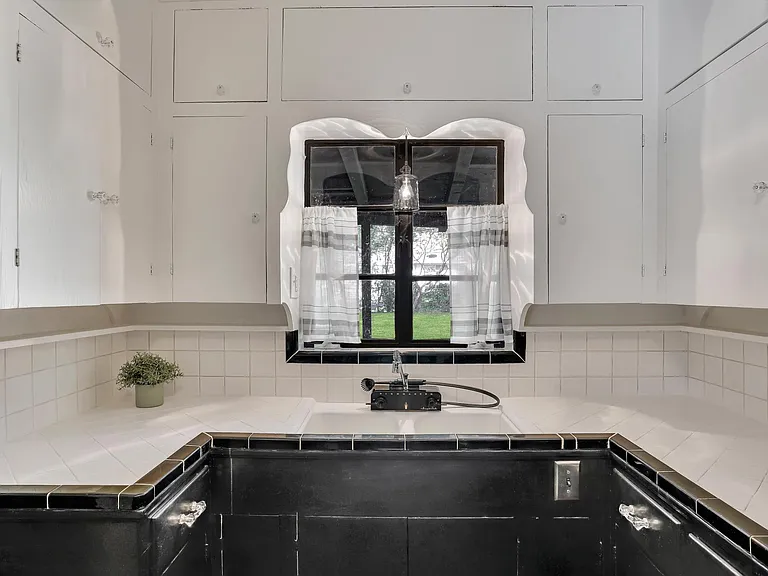 Kitchen with Dishmaster faucet.