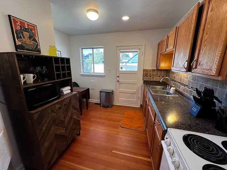 Spacious kitchen with back door to private outdoor space