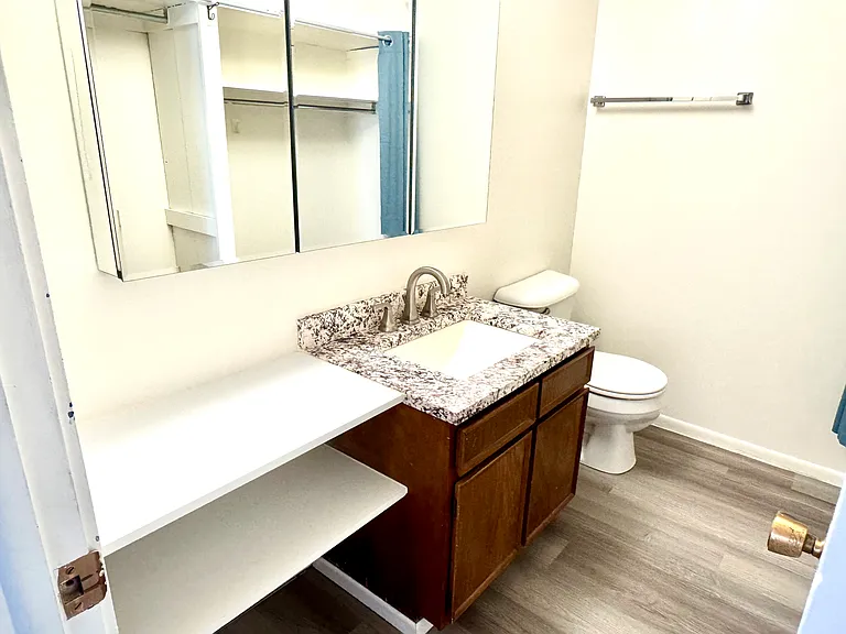 En-suite bathroom to larger bedroom. Includes storage closets etc.