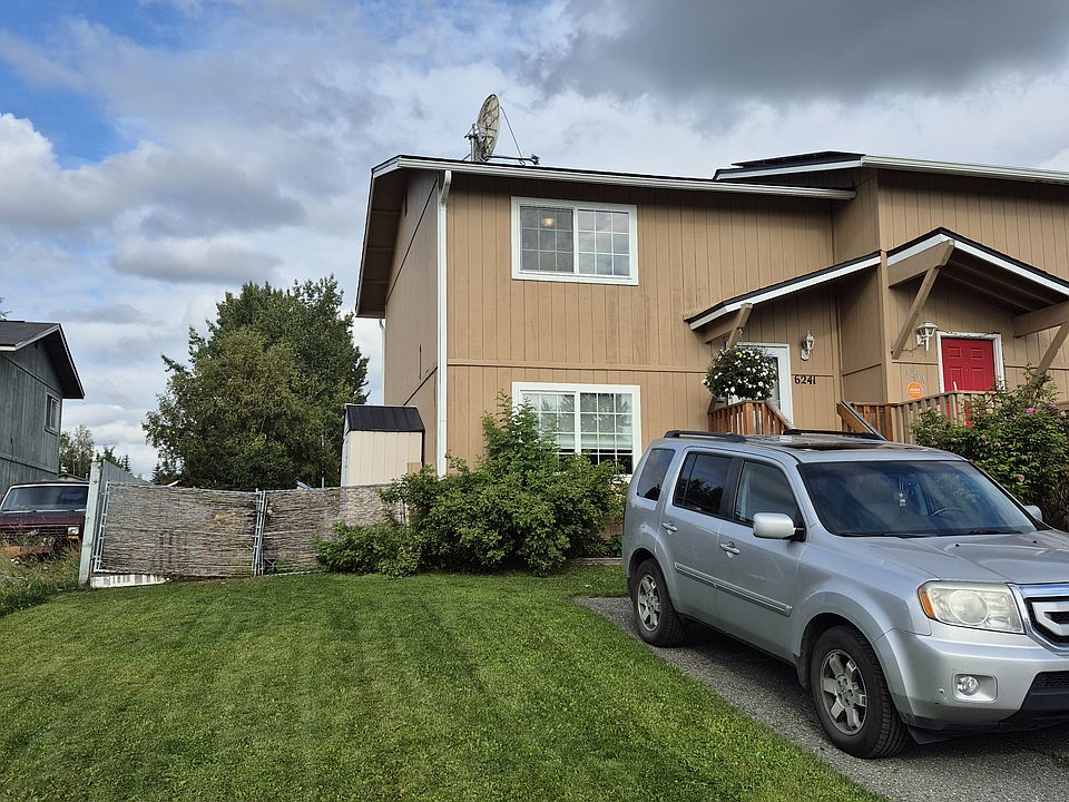 Front view. Driveway fits 2 cars