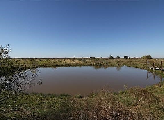 Beautiful Pond Stocked with Catfish and Hybrid Bass. Fishing pier needs some repair.