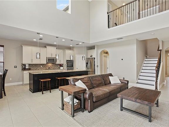 Spacious great room with double height ceiling and lots of natural light