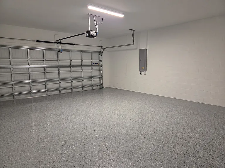 4' extended extra large garage, with epoxy floor for easy cleanup.