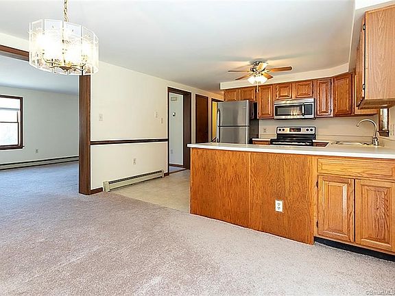 The main living level has an attractive open floor plan which flows easily from the kitchen, to the dining area and to the living room area. At the end of the hallways, and the top of the stairs from the basement, is the half bathroom / laundry room (with washing machine and dryer).