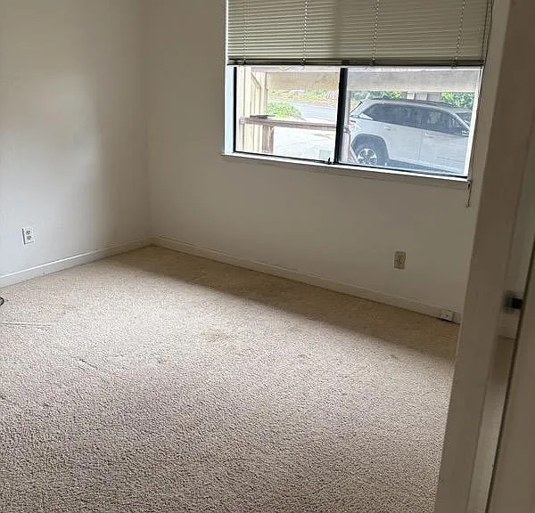 Large front bedroom (11' x 12') with wall-to-wall carpeting