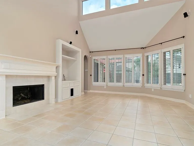 Living room has BOSE surround sound system built in. Gas fireplace. View to pool.