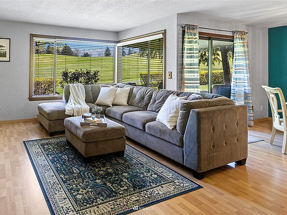 Enjoy sweeping views of the golf course from your living an dining rooms!